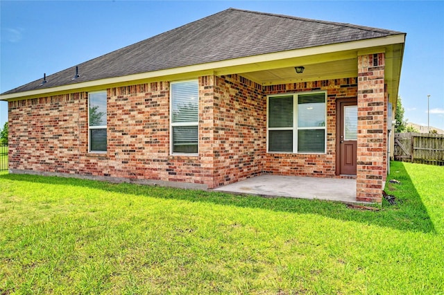 20610 Arrow Falls Ln, Richmond, TX 77407 - back of house with roof with shingles, a patio, and brick siding