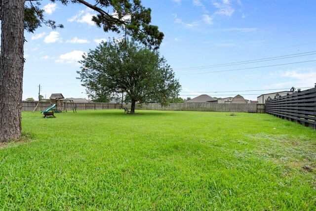 1814 Caroline Ave, Baytown, TX 77523 - view of yard featuring a playground