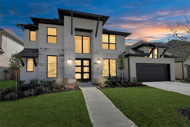 10414 Cloud Shimmer Trce, Richmond, TX 77406 - contemporary home with a front yard, concrete driveway, brick siding, and french doors