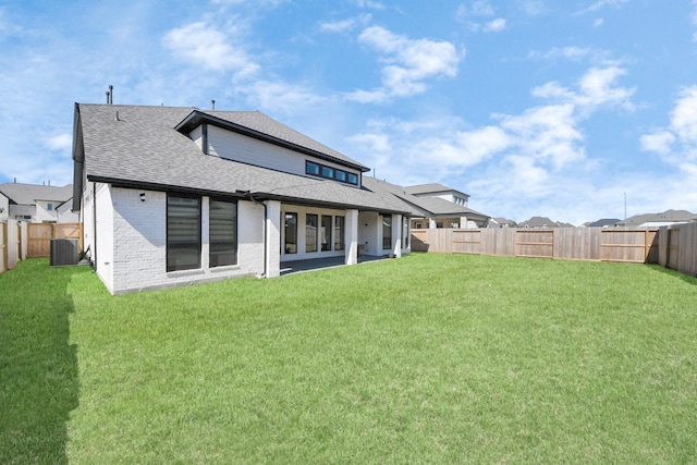 10414 Cloud Shimmer Trce, Richmond, TX 77406 - rear view of house featuring central AC unit, roof with shingles, and brick siding