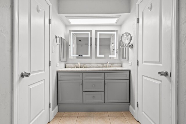 10507 Stockman Ln, Sugar Land, TX 77498 - full bathroom with double vanity and tile patterned floors