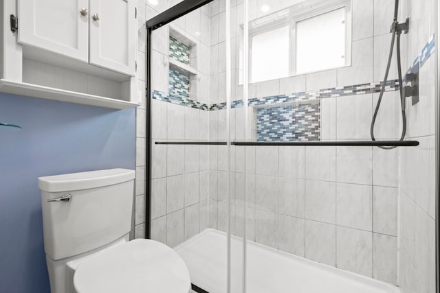 10507 Stockman Ln, Sugar Land, TX 77498 - bathroom featuring toilet and tiled shower