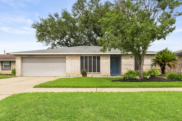 10507 Stockman Ln, Sugar Land, TX 77498 - view of front of home with an attached garage, driveway, and a front yard