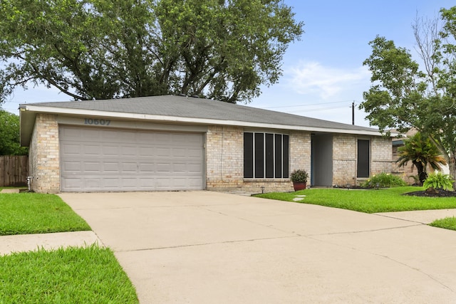 10507 Stockman Ln, Sugar Land, TX 77498 - view of front of property with concrete driveway, a garage, and brick siding