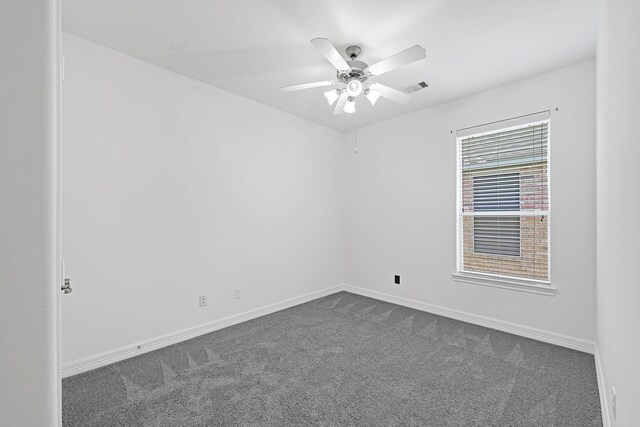 21357 Thurston Crossing Dr, Porter, TX 77365 - spare room with dark carpet, ceiling fan, and baseboards
