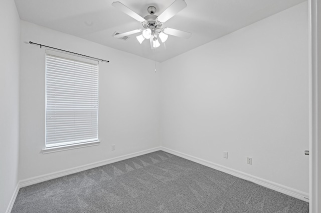 21357 Thurston Crossing Dr, Porter, TX 77365 - unfurnished room with dark colored carpet, baseboards, and ceiling fan
