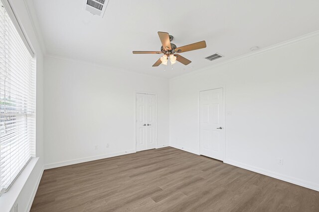 21357 Thurston Crossing Dr, Porter, TX 77365 - spare room with a ceiling fan, wood finished floors, ornamental molding, and baseboards