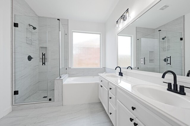 21357 Thurston Crossing Dr, Porter, TX 77365 - bathroom with a bath, a shower stall, double vanity, and marble finish flooring