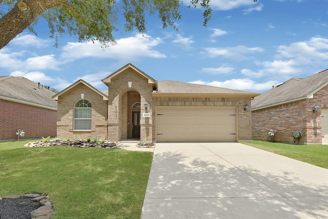 21357 Thurston Crossing Dr, Porter, TX 77365 - view of front of property with an attached garage, a front lawn, concrete driveway, and brick siding
