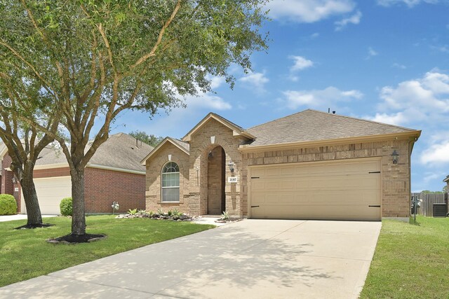 21357 Thurston Crossing Dr, Porter, TX 77365 - view of front of house with brick siding, a garage, concrete driveway, and a front yard