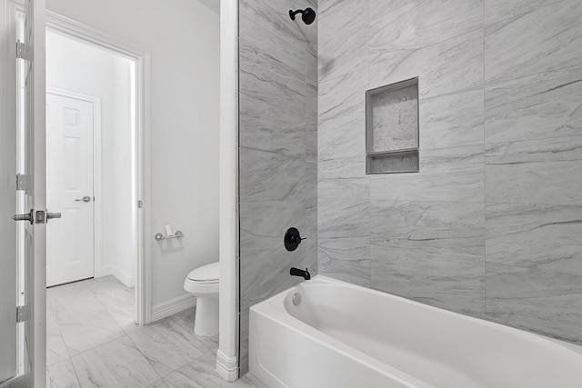 21357 Thurston Crossing Dr, Porter, TX 77365 - bathroom featuring toilet, marble finish floors, baseboards, and bathing tub / shower combination