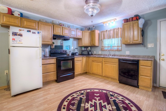 712 E Morris St, Madisonville, TX 77864 - kitchen with black appliances, under cabinet range hood, a sink, light wood finished floors, and a textured ceiling
