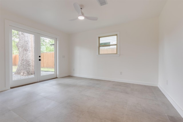 1730 Wakefield Dr, Houston, TX 77018 - empty room with french doors, baseboards, a ceiling fan, and light tile patterned flooring