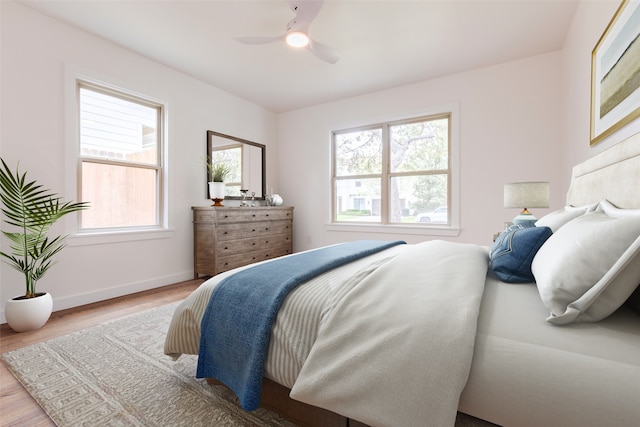 1730 Wakefield Dr, Houston, TX 77018 - bedroom featuring multiple windows, wood finished floors, ceiling fan, and baseboards