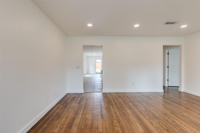 1730 Wakefield Dr, Houston, TX 77018 - unfurnished room with baseboards, dark wood-style floors, and recessed lighting