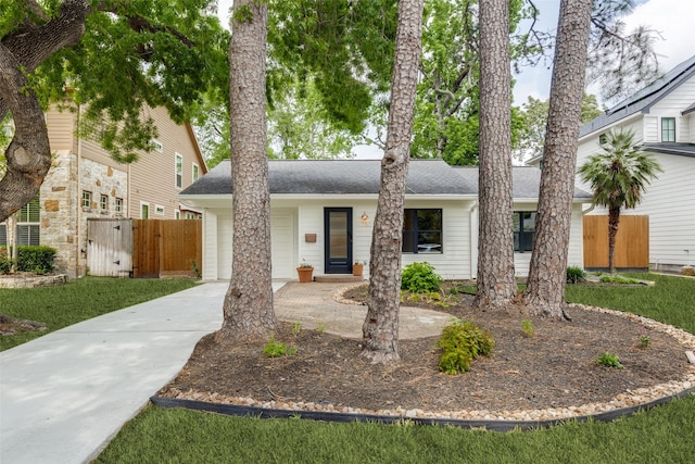 1730 Wakefield Dr, Houston, TX 77018 - view of front facade with driveway, a garage, a shingled roof, and a gate