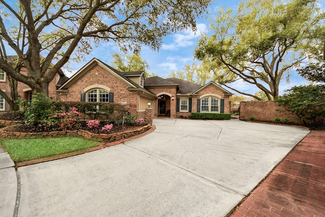 1542 Orchard Park Dr, Houston, TX 77077 - traditional-style house with brick siding, a shingled roof, and concrete driveway