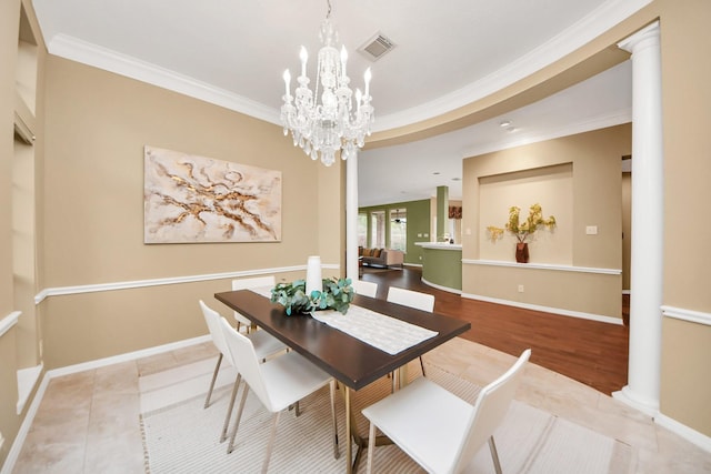 1542 Orchard Park Dr, Houston, TX 77077 - dining space with crown molding, decorative columns, a chandelier, and baseboards