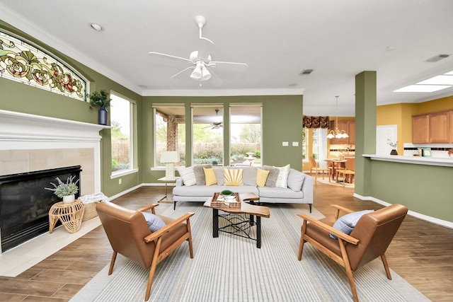1542 Orchard Park Dr, Houston, TX 77077 - living area with wood finished floors, a ceiling fan, ornamental molding, and baseboards