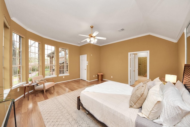 1542 Orchard Park Dr, Houston, TX 77077 - bedroom with light wood finished floors, multiple windows, ornamental molding, baseboards, and lofted ceiling