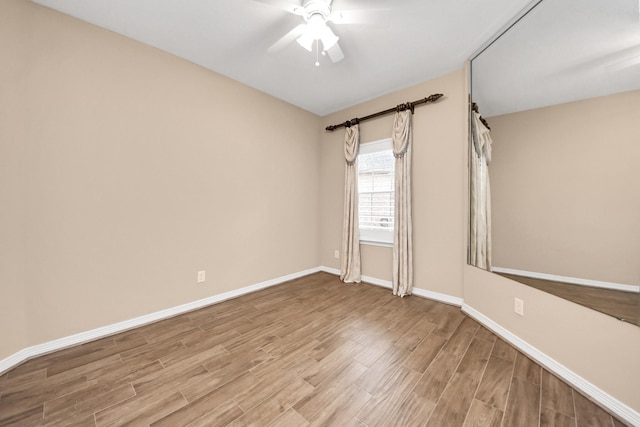 1542 Orchard Park Dr, Houston, TX 77077 - unfurnished room with a ceiling fan, light wood-style flooring, and baseboards