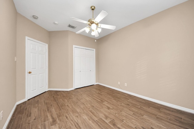 1542 Orchard Park Dr, Houston, TX 77077 - unfurnished bedroom featuring baseboards, wood finished floors, a closet, and ceiling fan