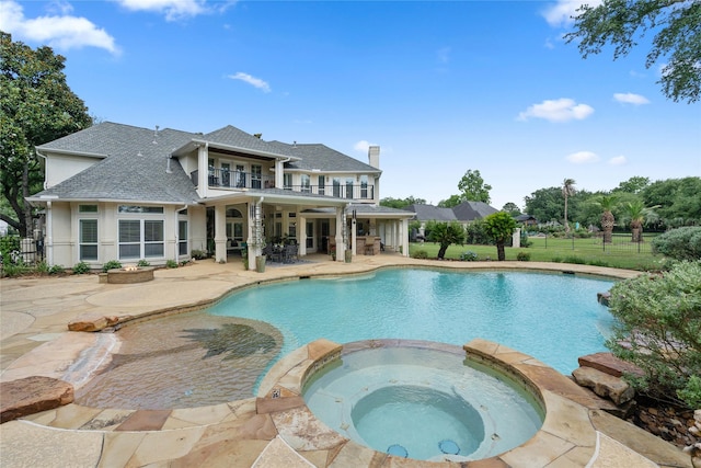 9611 Stonebridge Pl, Tomball, TX 77375 - view of swimming pool with a patio area and a pool with connected hot tub