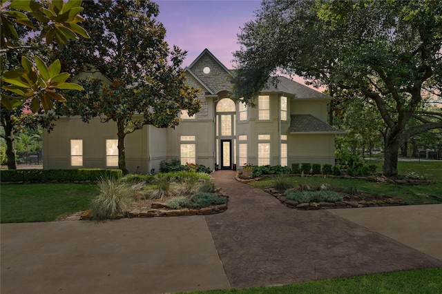9611 Stonebridge Pl, Tomball, TX 77375 - view of front of house featuring stucco siding and a front yard