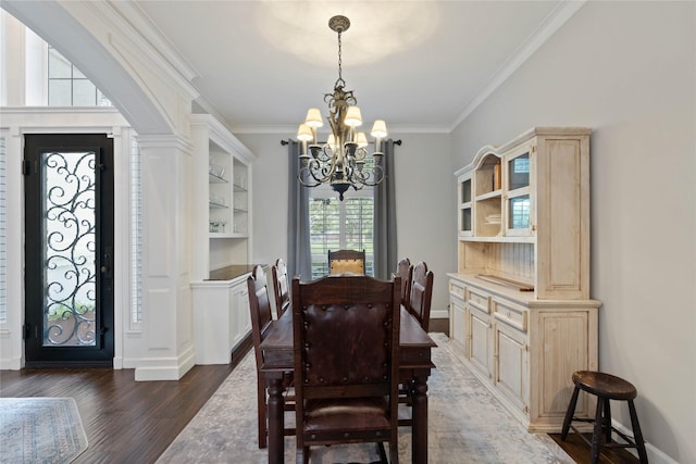 9611 Stonebridge Pl, Tomball, TX 77375 - dining area with a chandelier, ornamental molding, wood finished floors, and baseboards