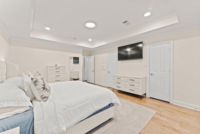 9382 Livernois Rd, Houston, TX 77080 - bedroom with a raised ceiling, crown molding, light wood-style flooring, baseboards, and recessed lighting