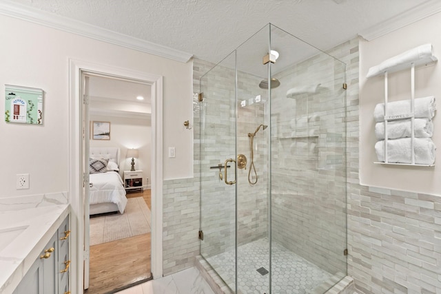 9382 Livernois Rd, Houston, TX 77080 - ensuite bathroom featuring vanity, ornamental molding, and a stall shower