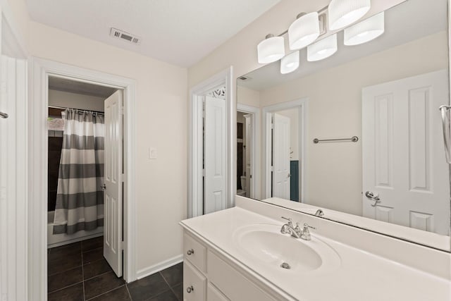 9382 Livernois Rd, Houston, TX 77080 - full bath featuring vanity, tile patterned flooring, baseboards, and a shower with shower curtain
