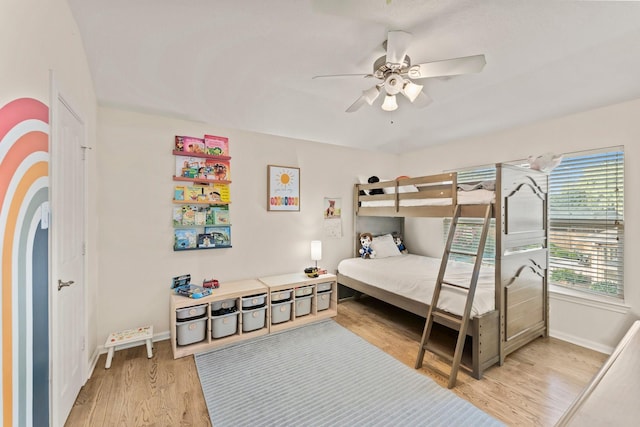 9382 Livernois Rd, Houston, TX 77080 - bedroom with light wood finished floors, baseboards, and ceiling fan