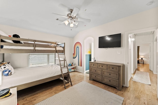 9382 Livernois Rd, Houston, TX 77080 - bedroom featuring attic access, light wood-style flooring, baseboards, vaulted ceiling, and ceiling fan