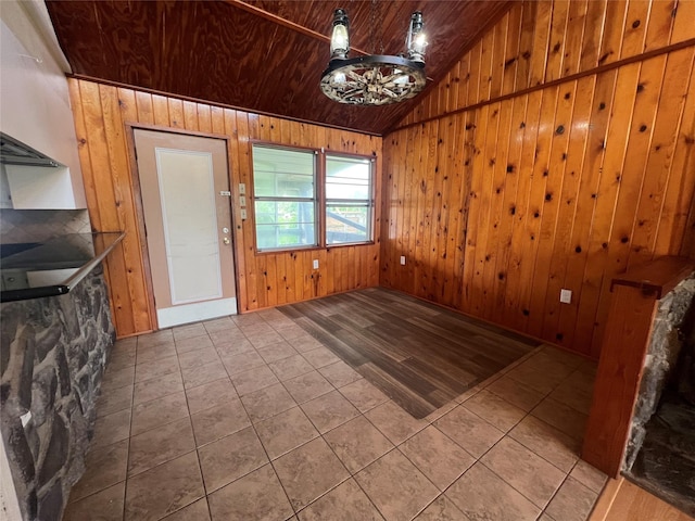 10011 Schanzer Rd, Hitchcock, TX 77563 - unfurnished dining area with vaulted ceiling, wood walls, tile patterned flooring, and wood ceiling