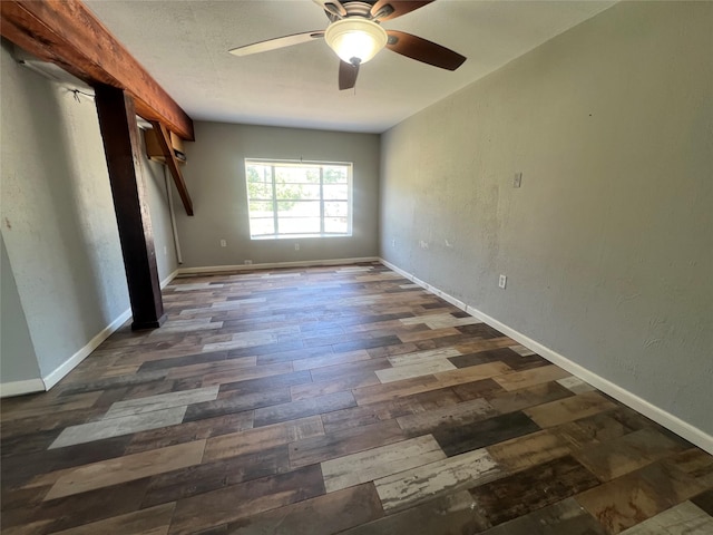 10011 Schanzer Rd, Hitchcock, TX 77563 - unfurnished bedroom featuring dark wood-style flooring, baseboards, and a ceiling fan