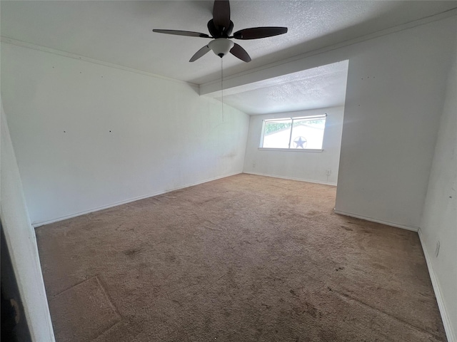 10011 Schanzer Rd, Hitchcock, TX 77563 - empty room with carpet floors, a ceiling fan, lofted ceiling, baseboards, and a textured ceiling