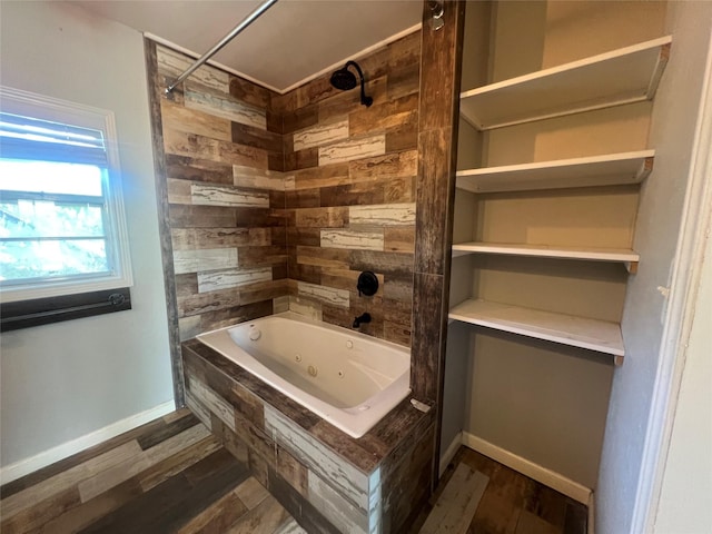 10011 Schanzer Rd, Hitchcock, TX 77563 - full bathroom featuring a combined bath / shower with jetted tub, wood finished floors, and baseboards