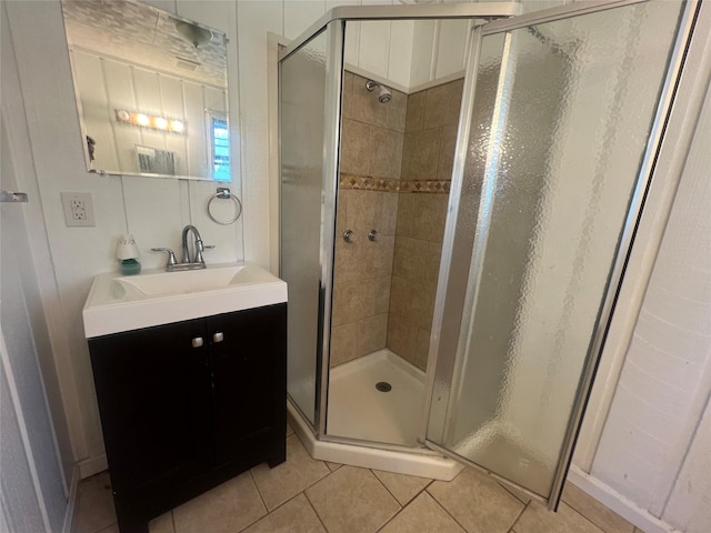 10011 Schanzer Rd, Hitchcock, TX 77563 - full bathroom with a shower stall, tile patterned floors, and vanity