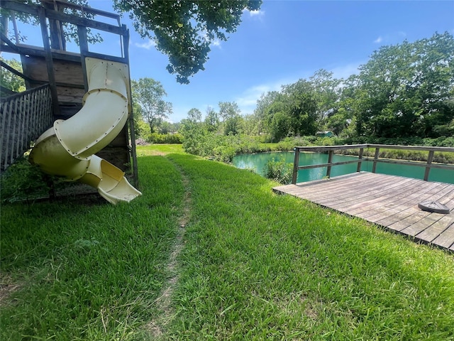 10011 Schanzer Rd, Hitchcock, TX 77563 - view of grassy yard with a deck with water view