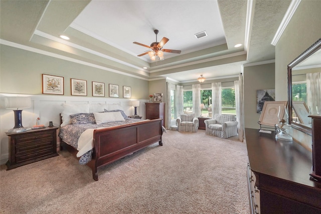 5112 E Settlers Bnd, Montgomery, TX 77316 - carpeted bedroom with a tray ceiling, ornamental molding, ceiling fan, and recessed lighting