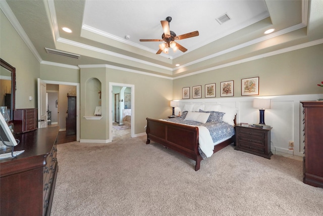 5112 E Settlers Bnd, Montgomery, TX 77316 - bedroom featuring a tray ceiling, ornamental molding, carpet, and a ceiling fan