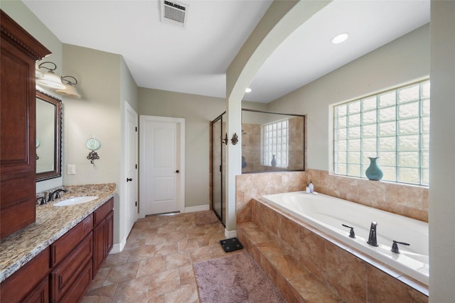 5112 E Settlers Bnd, Montgomery, TX 77316 - full bath featuring a stall shower, a garden tub, vanity, baseboards, and recessed lighting