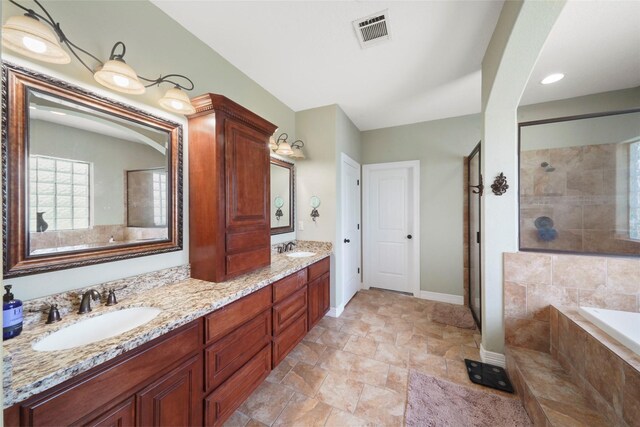 5112 E Settlers Bnd, Montgomery, TX 77316 - full bath with a bath, double vanity, a tile shower, and baseboards