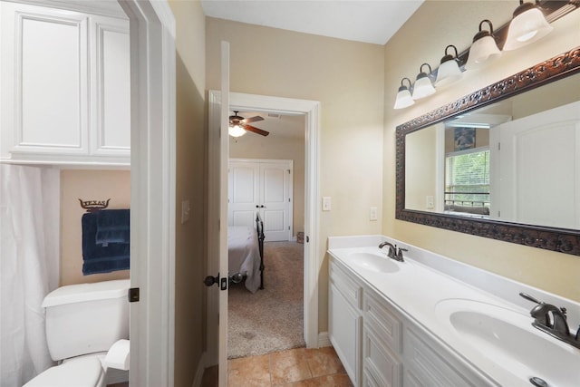 5112 E Settlers Bnd, Montgomery, TX 77316 - full bath featuring ensuite bath, double vanity, toilet, a ceiling fan, and tile patterned flooring