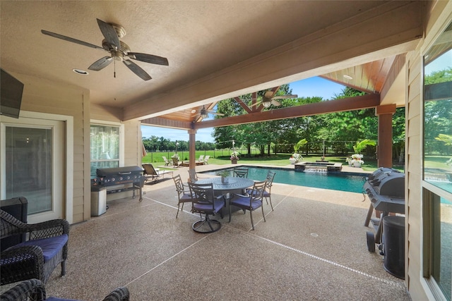 5112 E Settlers Bnd, Montgomery, TX 77316 - view of patio with a ceiling fan, outdoor dining space, a pool with connected hot tub, and area for grilling