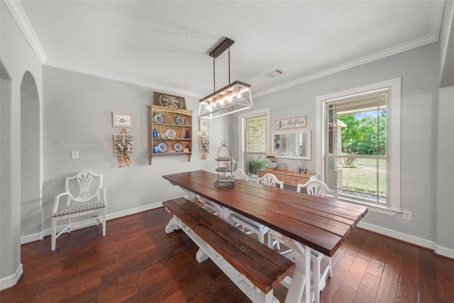 5112 E Settlers Bnd, Montgomery, TX 77316 - dining room with a chandelier, ornamental molding, hardwood / wood-style floors, arched walkways, and baseboards