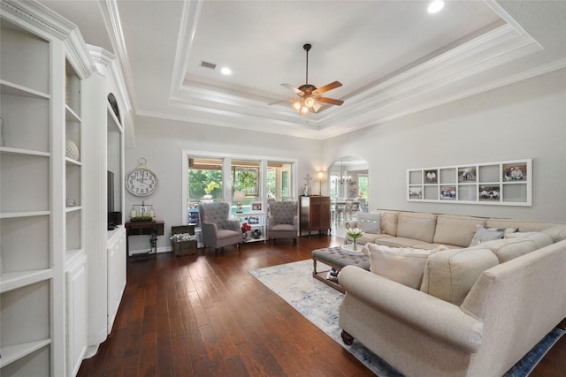 5112 E Settlers Bnd, Montgomery, TX 77316 - living room with a raised ceiling, arched walkways, ornamental molding, a ceiling fan, and dark wood-style floors
