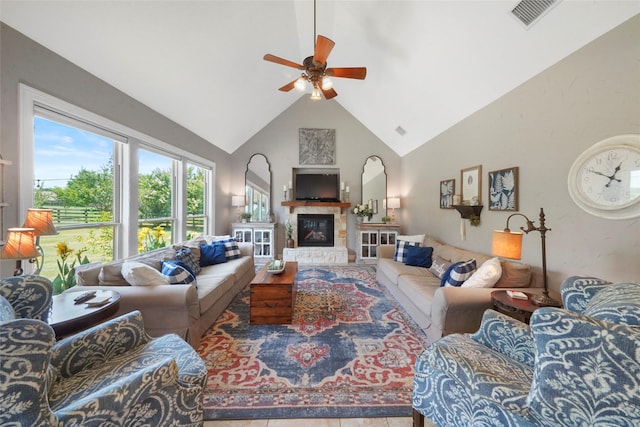 5112 E Settlers Bnd, Montgomery, TX 77316 - living area with high vaulted ceiling, a ceiling fan, and a stone fireplace