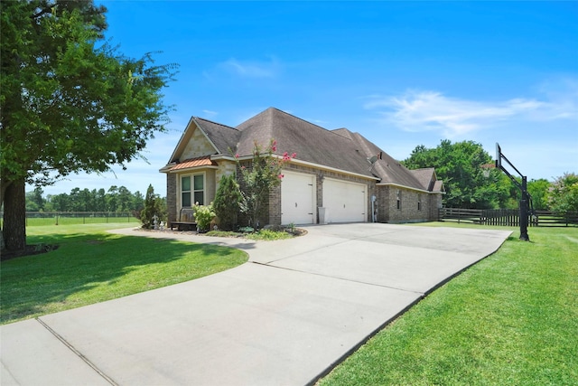 5112 E Settlers Bnd, Montgomery, TX 77316 - view of home's exterior featuring an attached garage, driveway, and brick siding